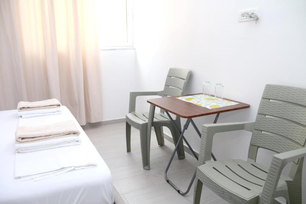Postel nebo postele na pokoji v ubytování Vila Jovani
