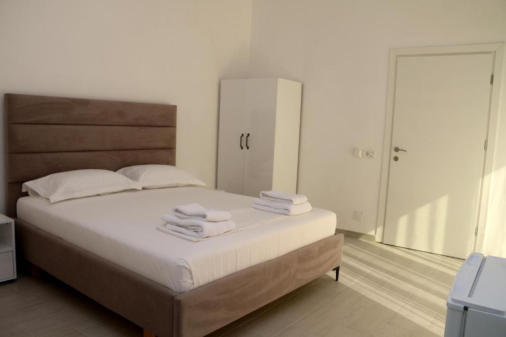 Postel nebo postele na pokoji v ubytování Vila Jovani