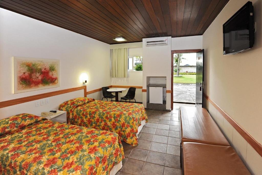 Postel nebo postele na pokoji v ubytování Hotel Pousada Lord
