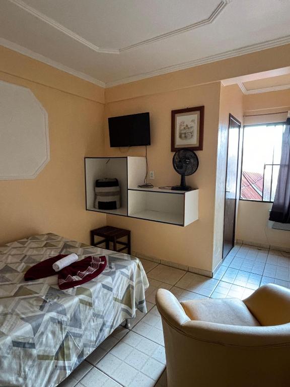 Postel nebo postele na pokoji v ubytování Hotel São Luis