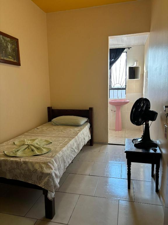 Postel nebo postele na pokoji v ubytování Hotel São Luis