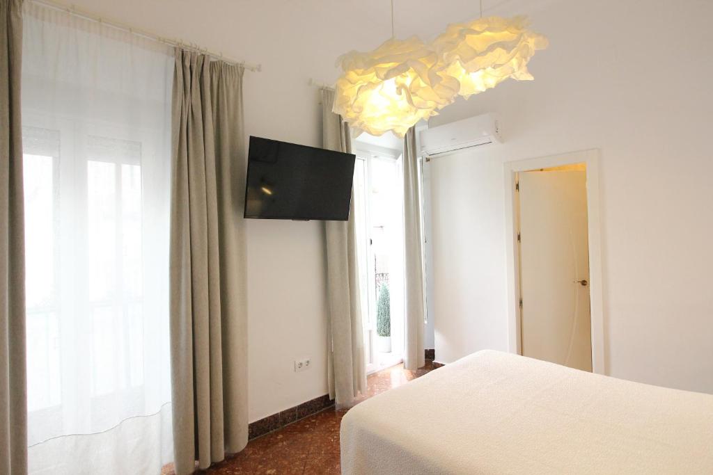 Televízia a/alebo spoločenská miestnosť v ubytovaní Las Atarazanas - Design Hostal