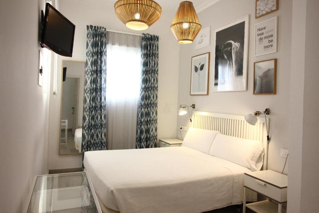 Posteľ alebo postele v izbe v ubytovaní Las Atarazanas - Design Hostal