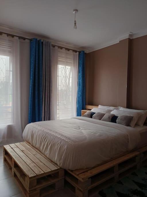 Postel nebo postele na pokoji v ubytování Talma Home