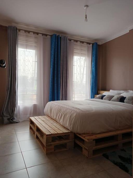Postel nebo postele na pokoji v ubytování Talma Home