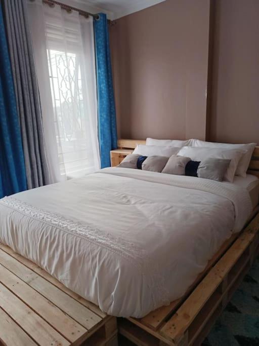 Postel nebo postele na pokoji v ubytování Talma Home