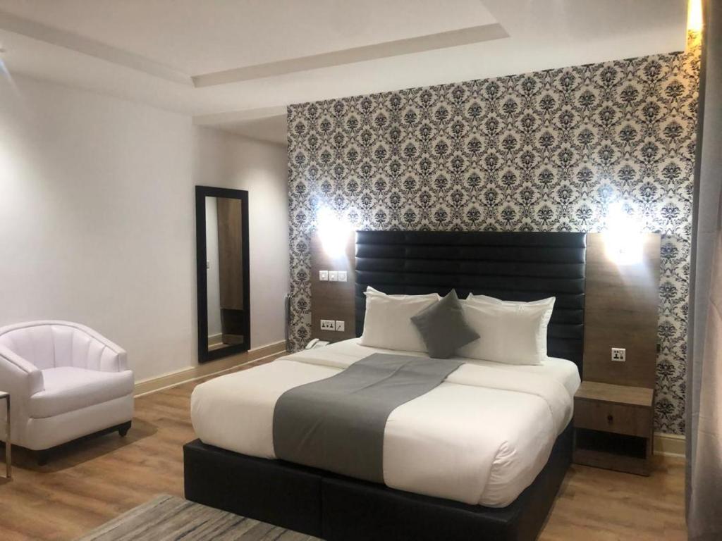 Postel nebo postele na pokoji v ubytování Crownsville Hotel - Airport Road