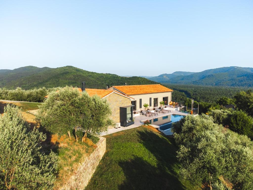 an aerial view of a villa with a swimming pool at Villa Horto with Heated Pool & Sauna in Livade