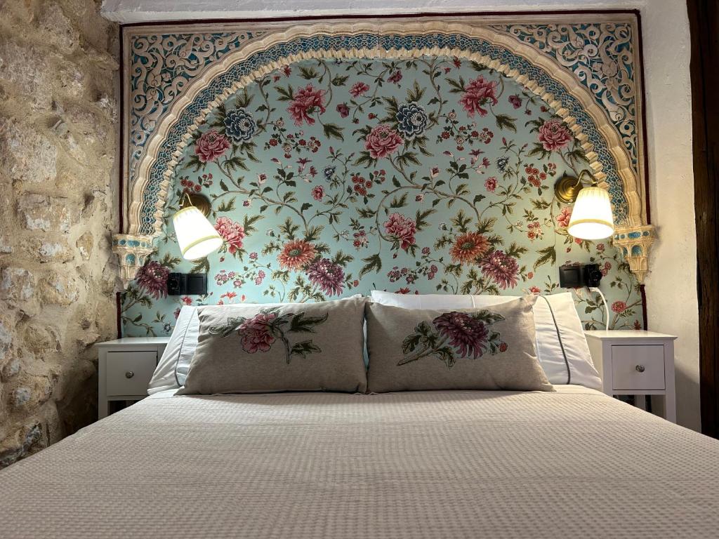 Un pat sau paturi într-o cameră la Las casillas de la villa BULERÍAS