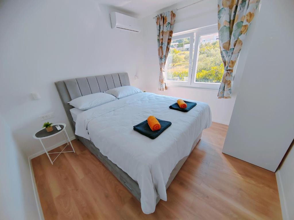 Postel nebo postele na pokoji v ubytování Apartments Alen