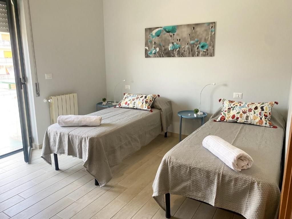 Posteľ alebo postele v izbe v ubytovaní B&B MaLò Family Friendly