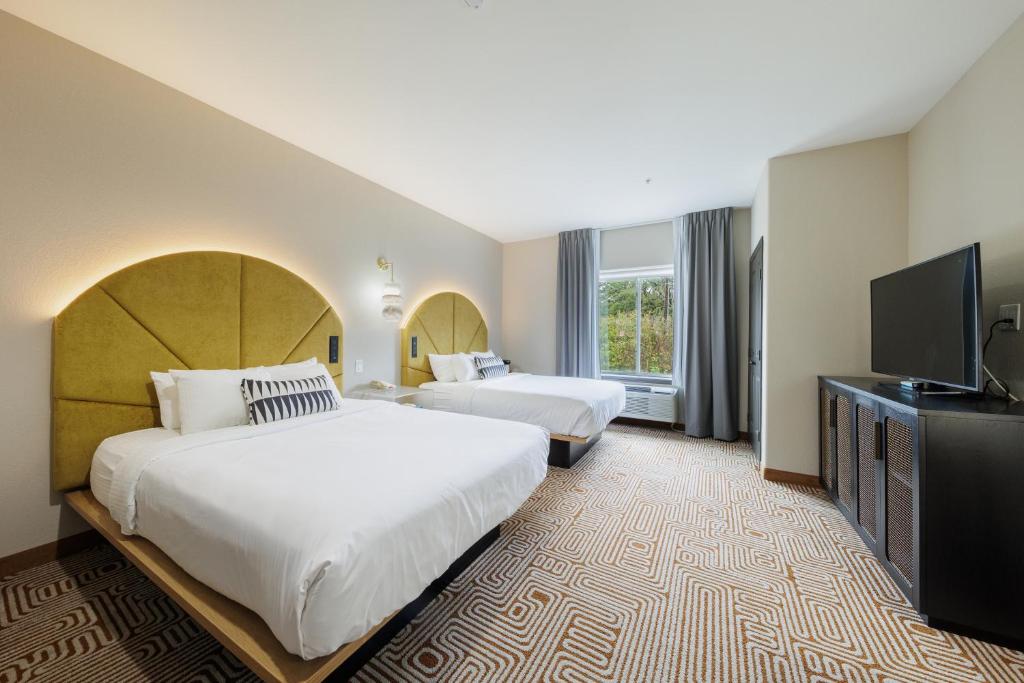 Postel nebo postele na pokoji v ubytování Blanco River Hotel