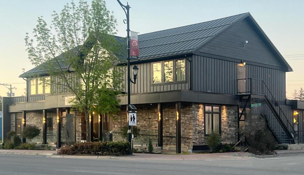 a large building with a black roof at the reid hotel in Vanderhoof