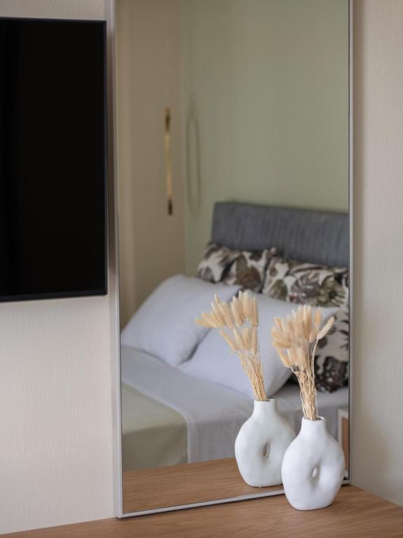 Postel nebo postele na pokoji v ubytování Endless Blue Luxury Suites