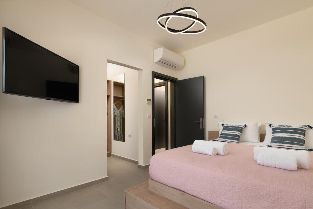 Postel nebo postele na pokoji v ubytování Pantheon Luxury Villas Rhodes Island