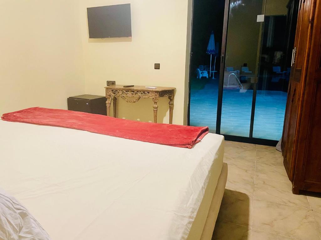Postel nebo postele na pokoji v ubytování Villa Baddi Marrakech