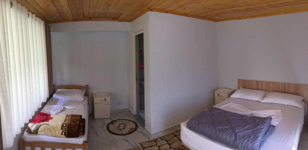 Postel nebo postele na pokoji v ubytování Zariklis