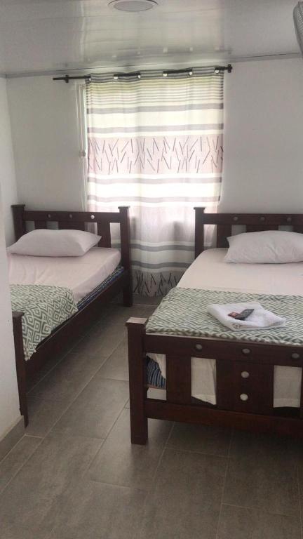 Postel nebo postele na pokoji v ubytování HOTEL Mira Cruz