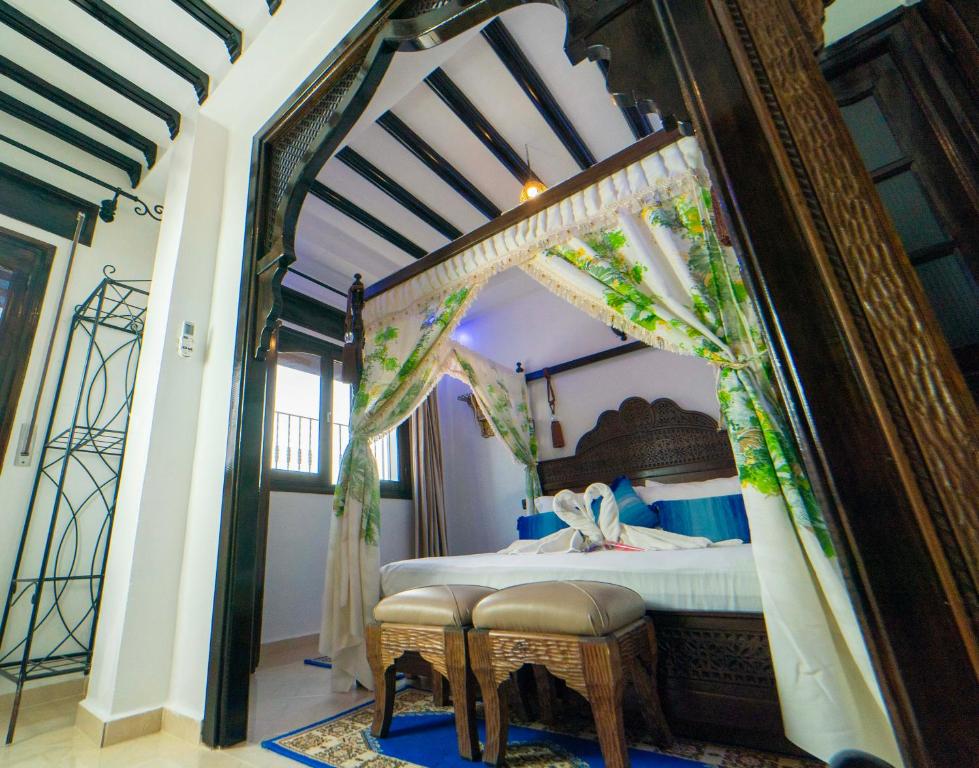 Postel nebo postele na pokoji v ubytování Maison d'hôtes Afassi