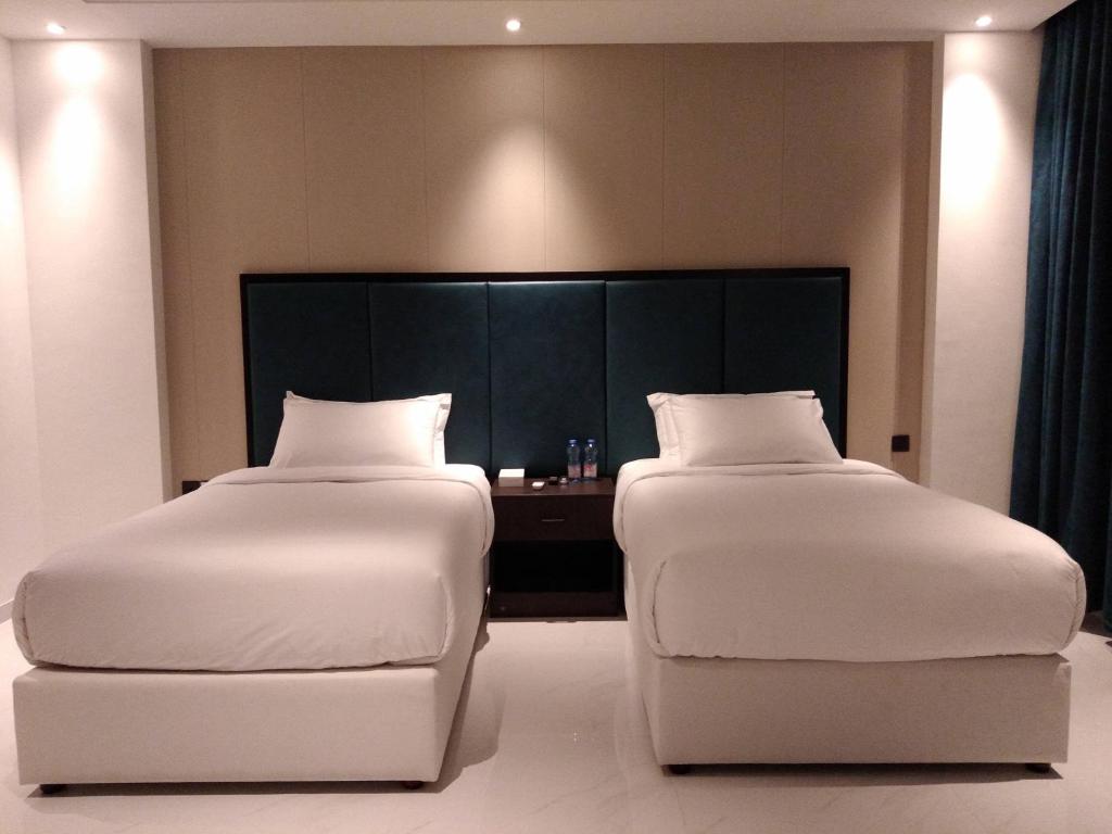 Postel nebo postele na pokoji v ubytování Nebula Hotel
