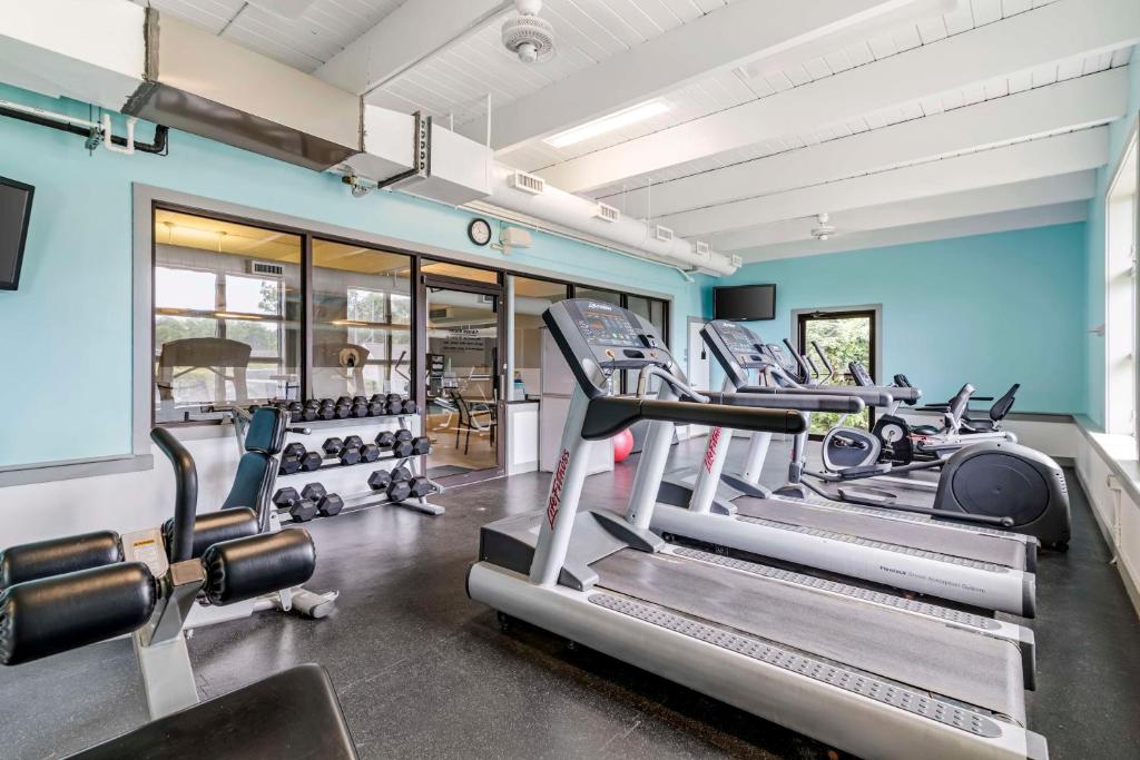 a gym with several tread machines in a room at Best Western Springfield Hotel in Springfield