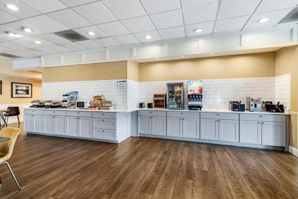 a large room with white counters and tables at Best Western Springfield Hotel in Springfield