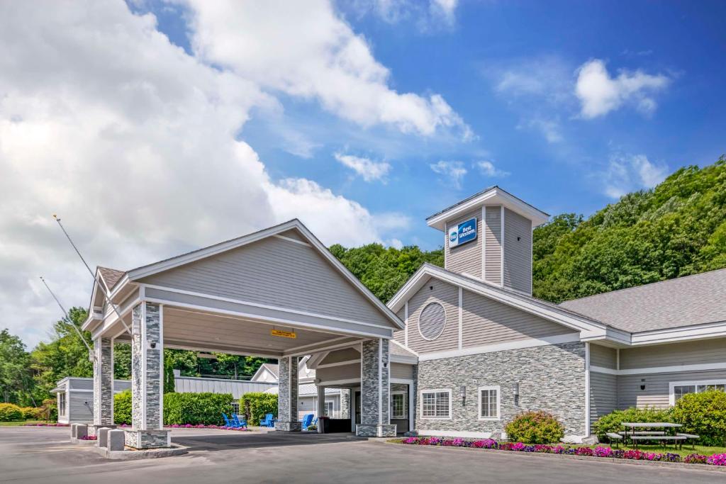 a house with a clock tower on top of it at Best Western Springfield Hotel in Springfield