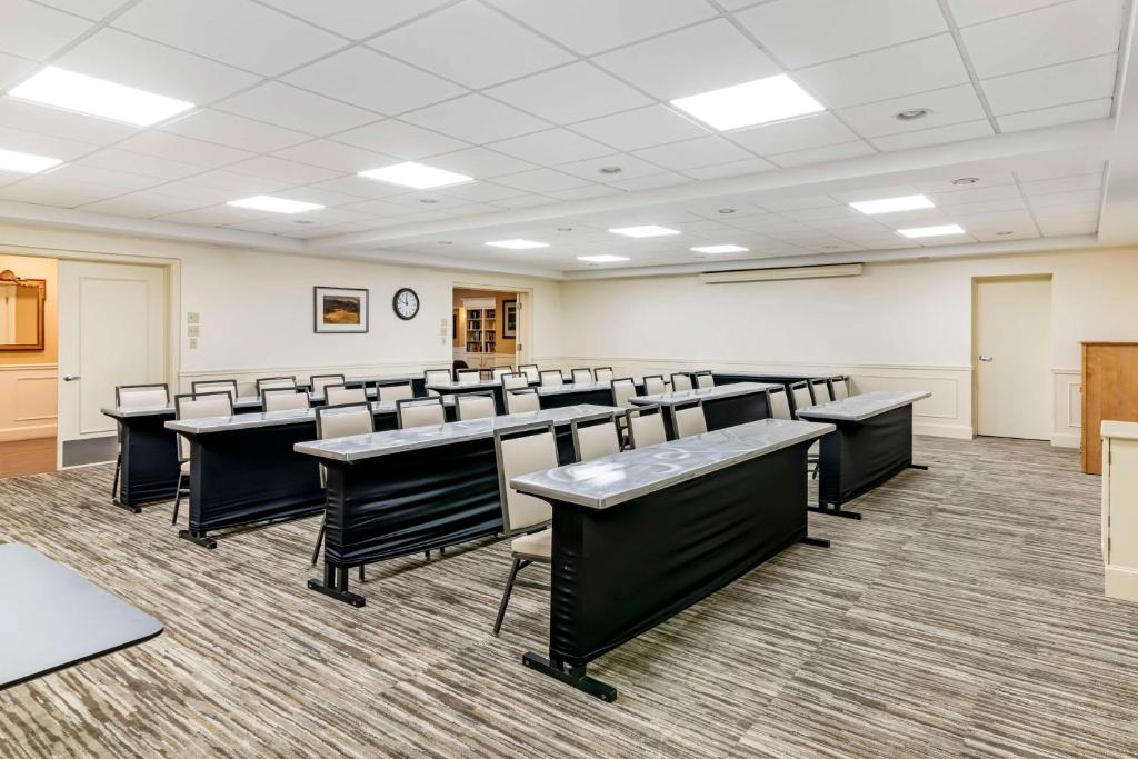 an empty lecture room with desks and chairs at Best Western Springfield Hotel in Springfield