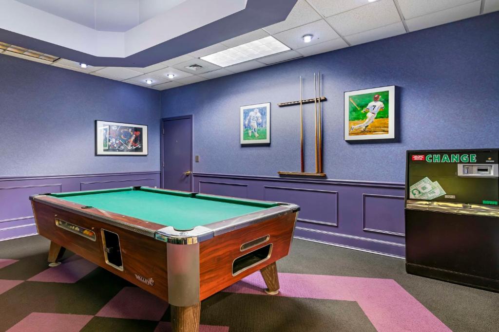 a billiard room with a pool table and a machine at Best Western Springfield Hotel in Springfield