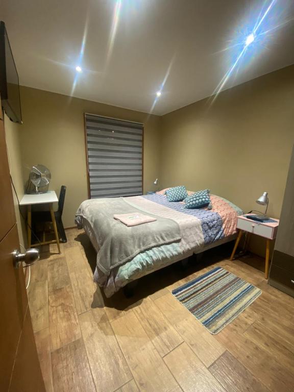 Ένα ή περισσότερα κρεβάτια σε δωμάτιο στο Hostal Ayiwün
