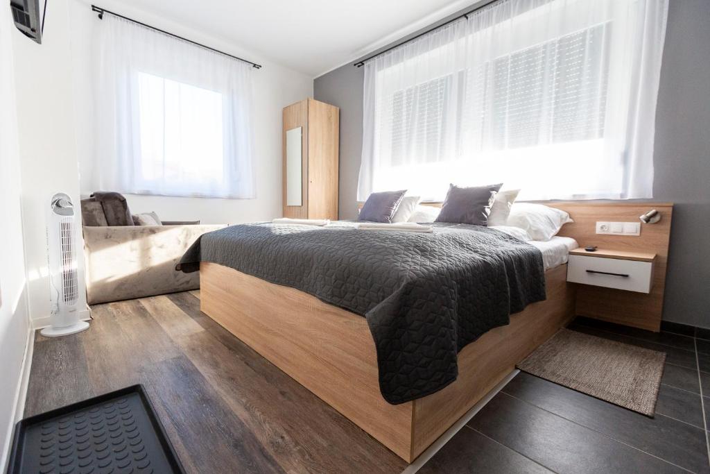 Postel nebo postele na pokoji v ubytování Horváth Apartman