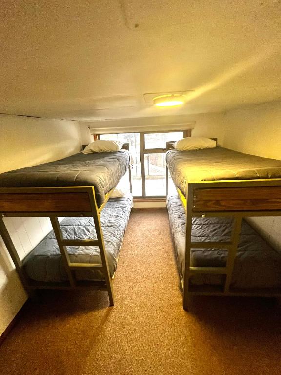 Postel nebo postele na pokoji v ubytování Hostel Rosa de los Vientos