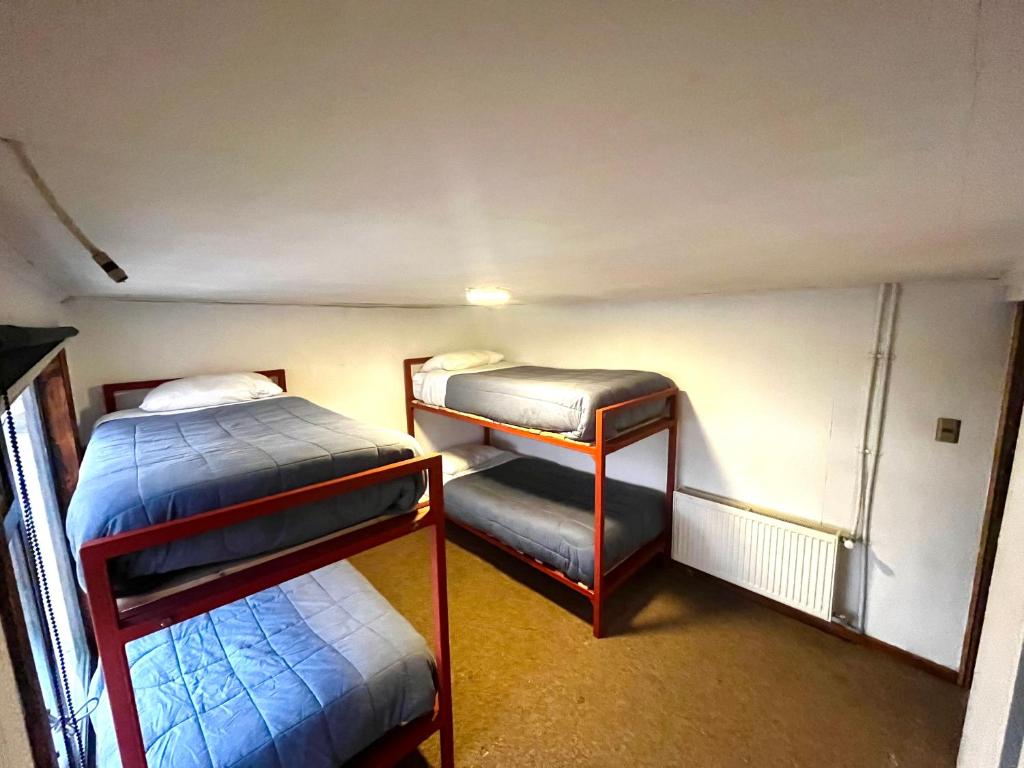 Postel nebo postele na pokoji v ubytování Hostel Rosa de los Vientos