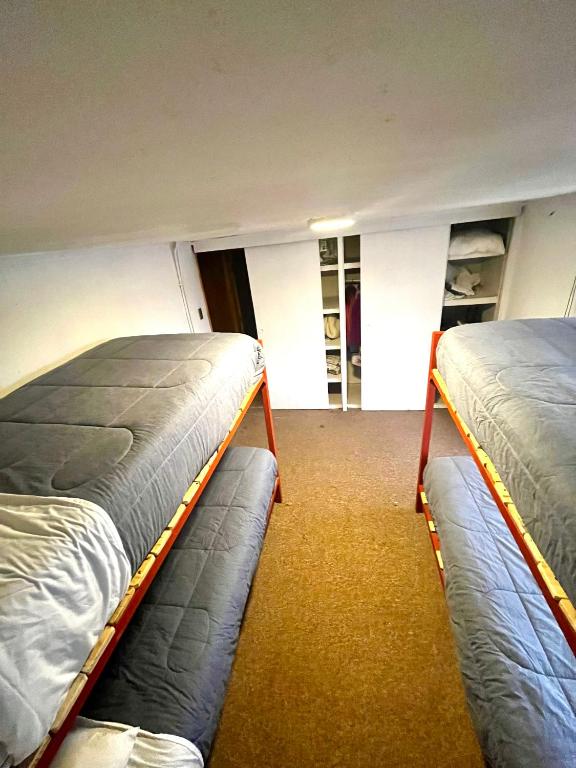 Postel nebo postele na pokoji v ubytování Hostel Rosa de los Vientos