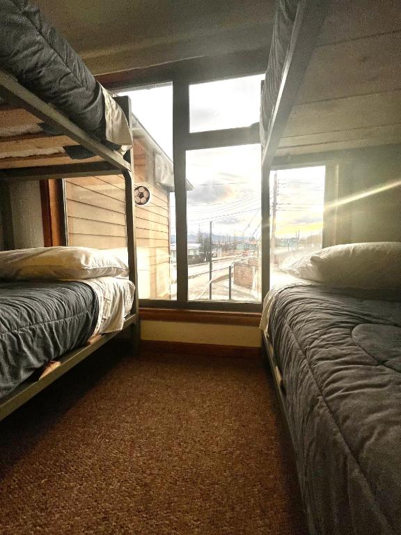Postel nebo postele na pokoji v ubytování Hostel Rosa de los Vientos
