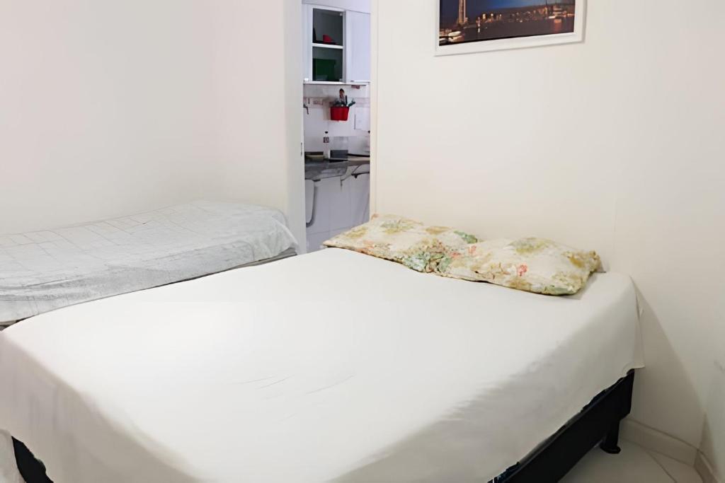Ένα ή περισσότερα κρεβάτια σε δωμάτιο στο Lindo flat no recreio dos bandeirantes(gilka machado)