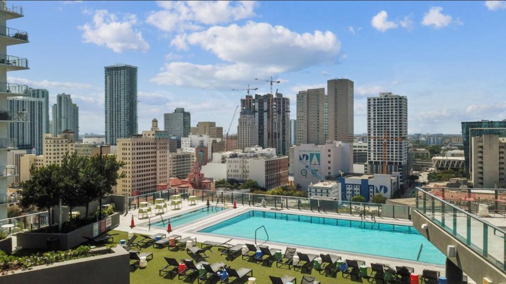 a large swimming pool on the roof of a building at Apartment in Miami downtown in Miami