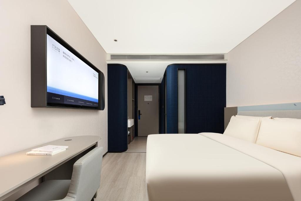 Letto o letti in una camera di Atour Light Hotel Wuxi Taihu Lake Expo Center Financial Street