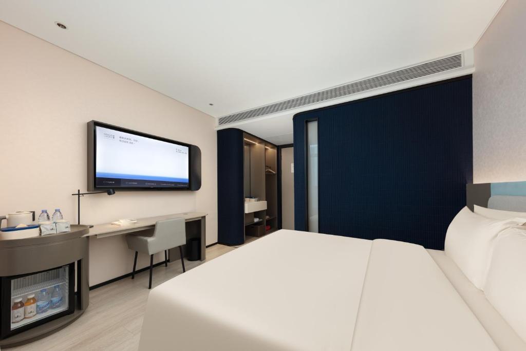 Letto o letti in una camera di Atour Light Hotel Wuxi Taihu Lake Expo Center Financial Street