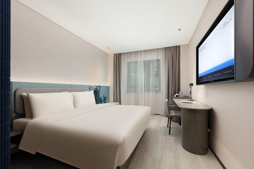 Letto o letti in una camera di Atour Light Hotel Wuxi Taihu Lake Expo Center Financial Street