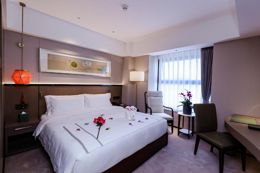 Postel nebo postele na pokoji v ubytování Beijing Guangdong Hotel