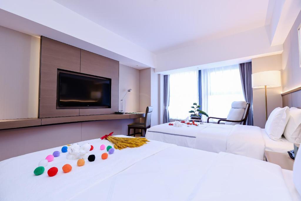 TV a/nebo společenská místnost v ubytování Beijing Guangdong Hotel