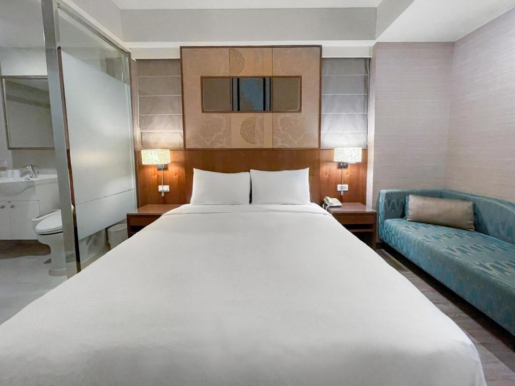 Postel nebo postele na pokoji v ubytování Guide Hotel Taipei NTU