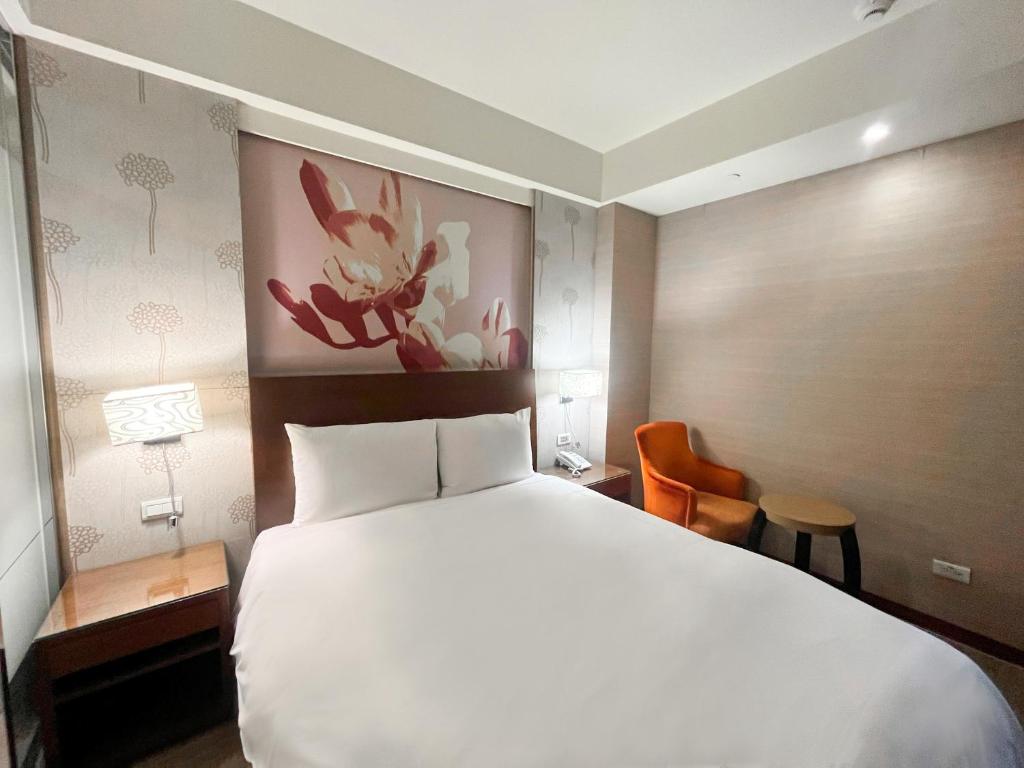 Postel nebo postele na pokoji v ubytování Guide Hotel Taipei NTU