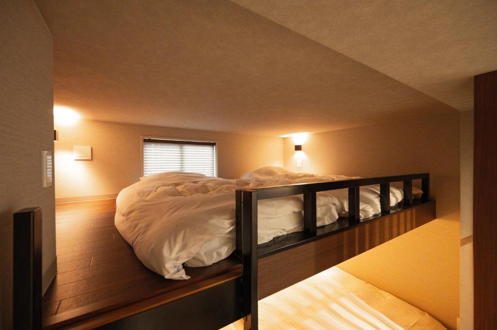 Postel nebo postele na pokoji v ubytování Hotel A'bant Shizuoka