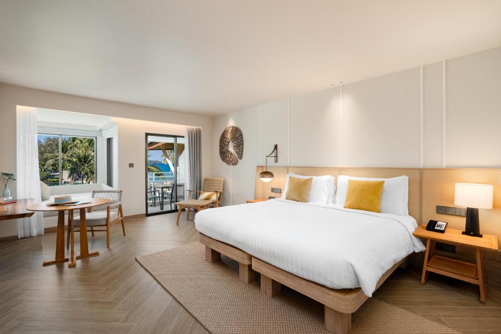 Postel nebo postele na pokoji v ubytování SAii Laguna Phuket