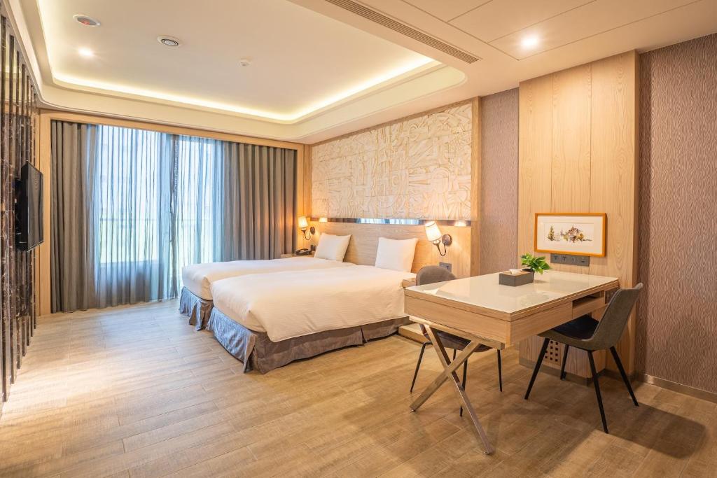 Postel nebo postele na pokoji v ubytování Guide Hotel Taichung Ziyou