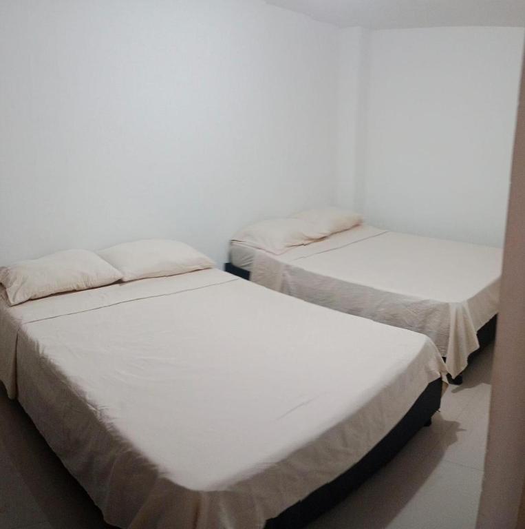 Postel nebo postele na pokoji v ubytování HOTEL IBIZA