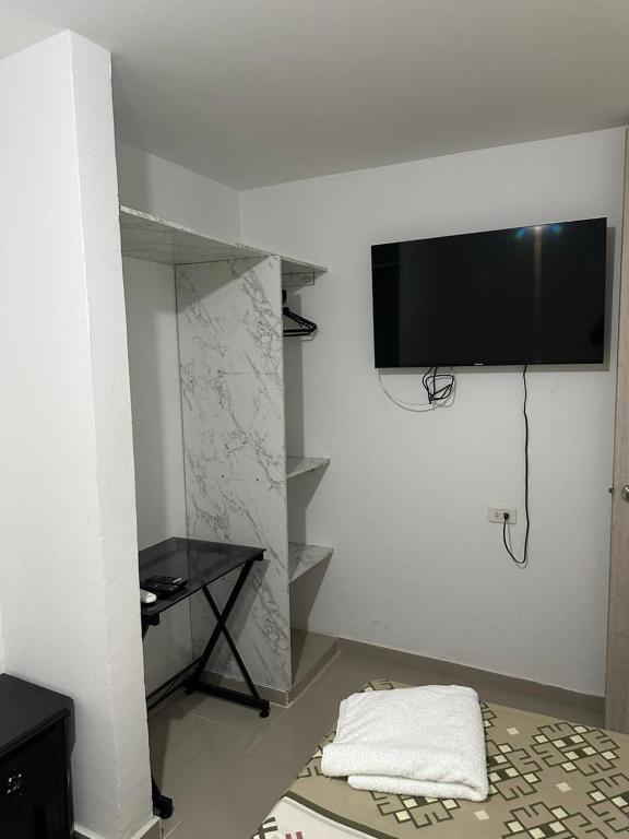 TV a/nebo společenská místnost v ubytování HOTEL IBIZA