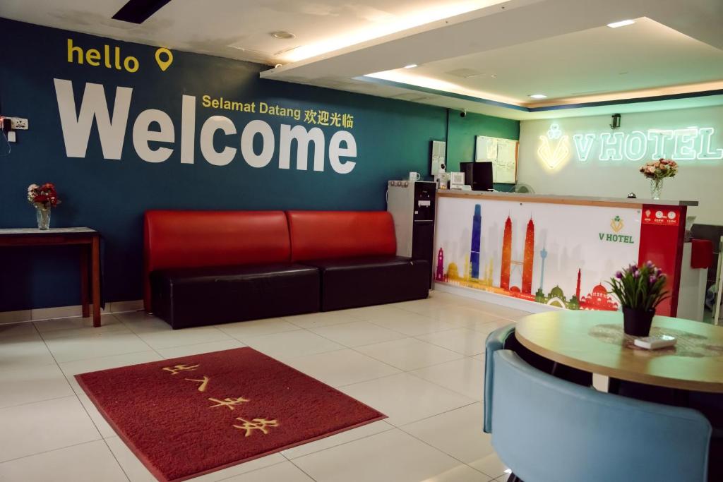a waiting room with a welcome sign on the wall at V Hotel Titiwangsa in Kuala Lumpur